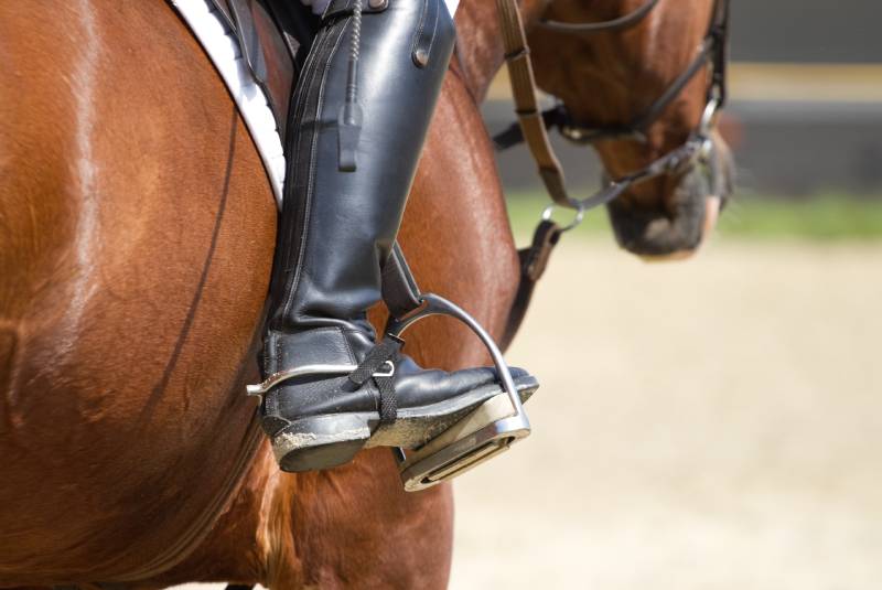 Jockey riding boots in the stirrup