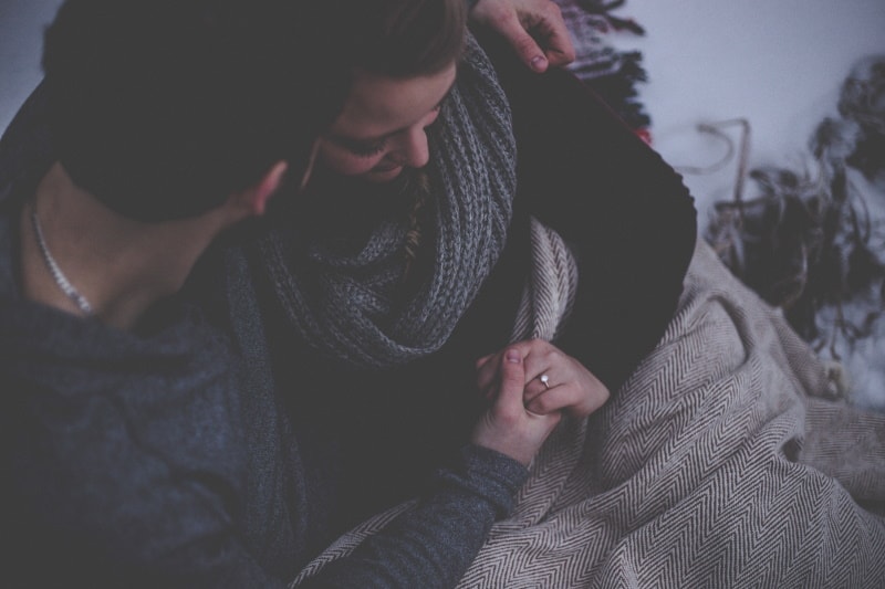 Man comforting woman after loss of pet