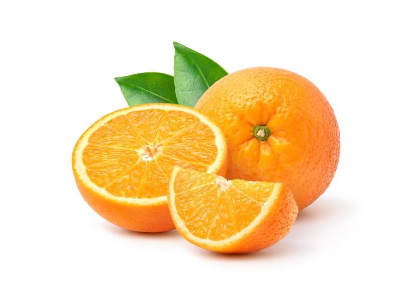 Orange with cut in half and green leaves isolated on white background