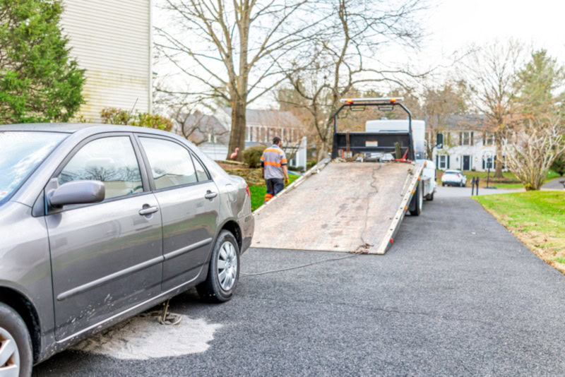 Placing cat litter under car to cover potholes