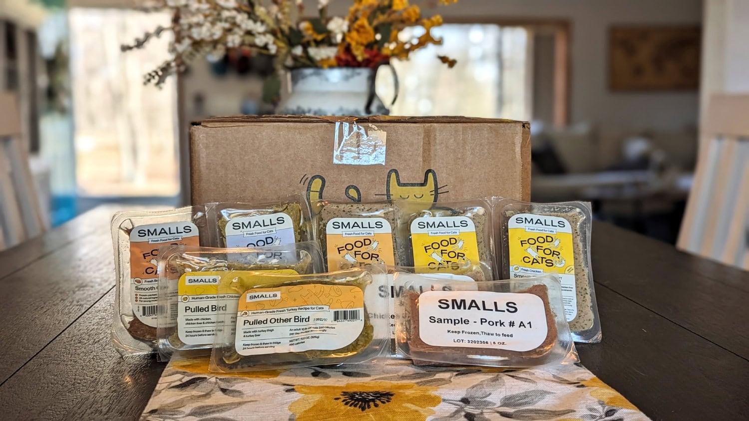 Small Cat Food - products and box on the table