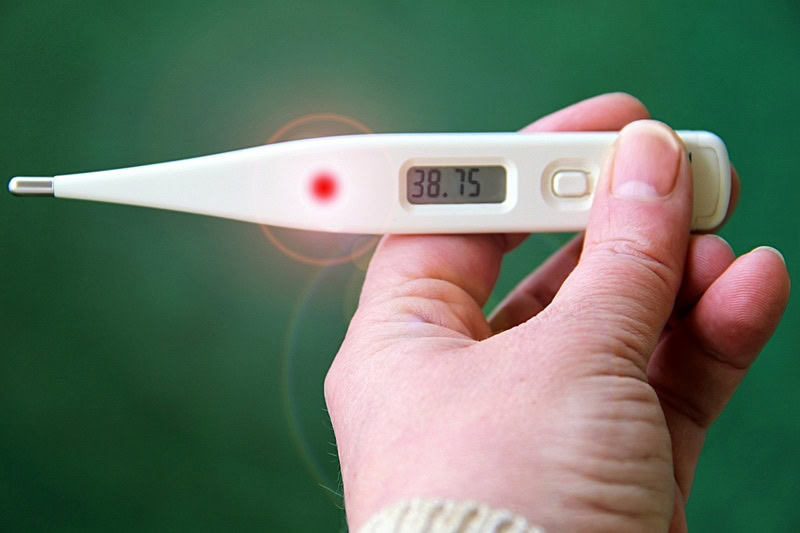 Thermometer reading showing fever