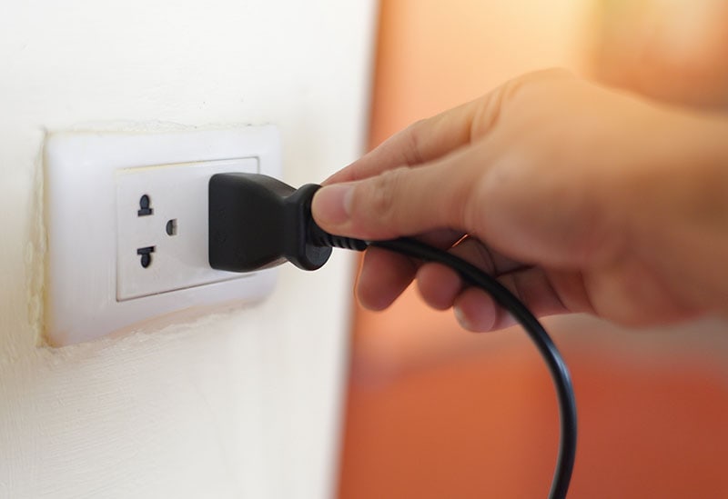 Unplug or plugged in concept socket on electric plug on wall