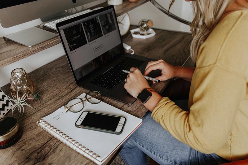 a woman working on her laptop