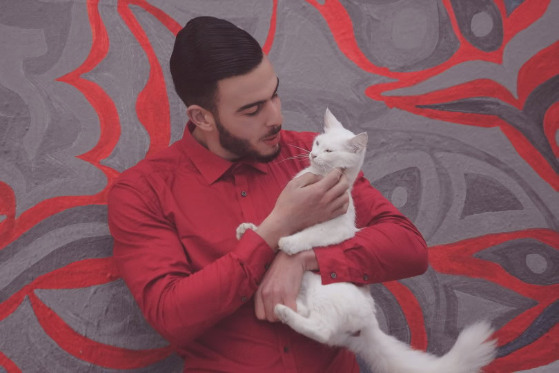 cat owner talking to his pet