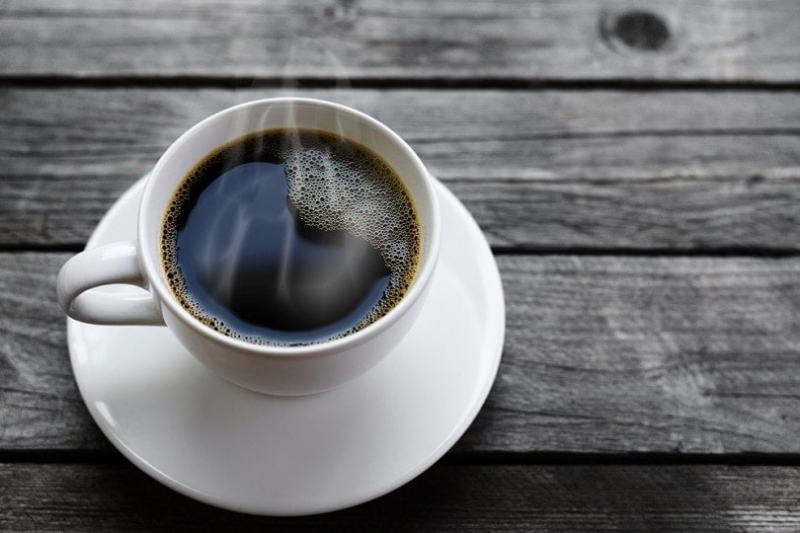 cup of coffee on wooden table