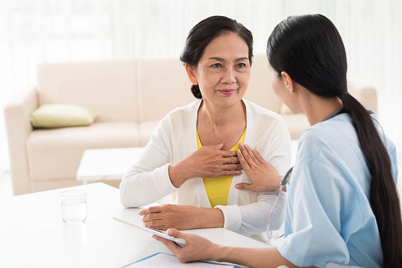 doctor and patient talking about heart disease
