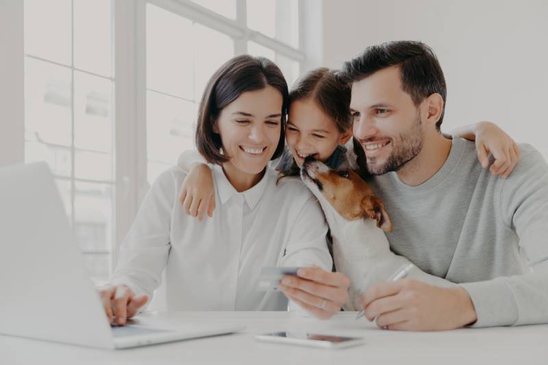 family with pet dog opening pet savings account