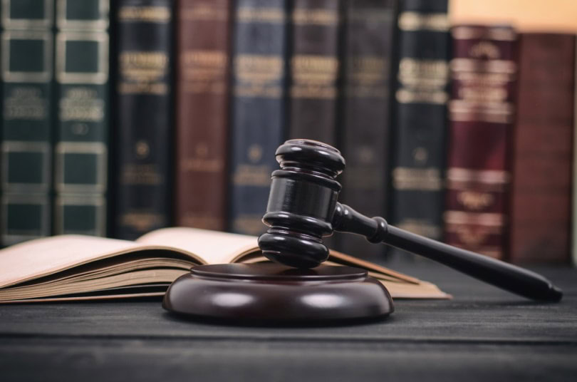 judge, gavel, and law book
