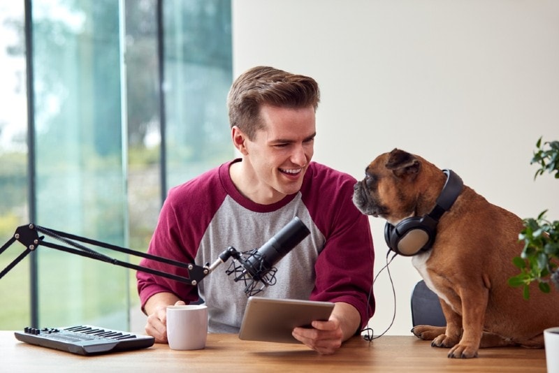 man on a podcast with his dog