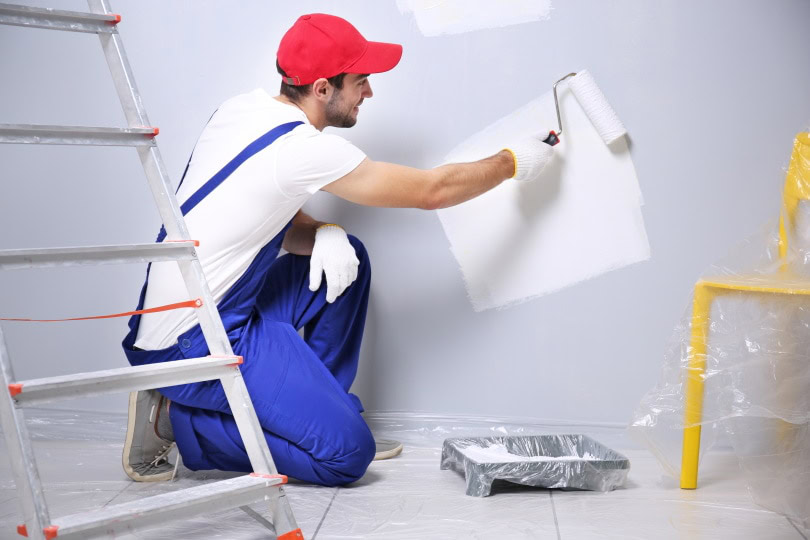 man painting the wall