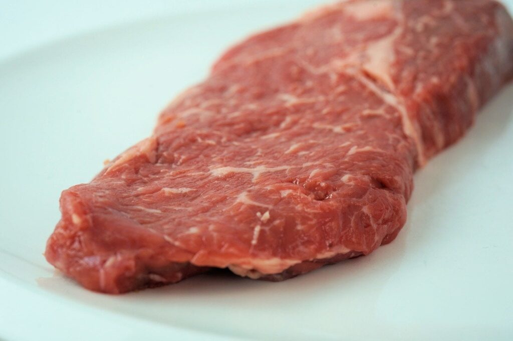 raw meat on white tabletop