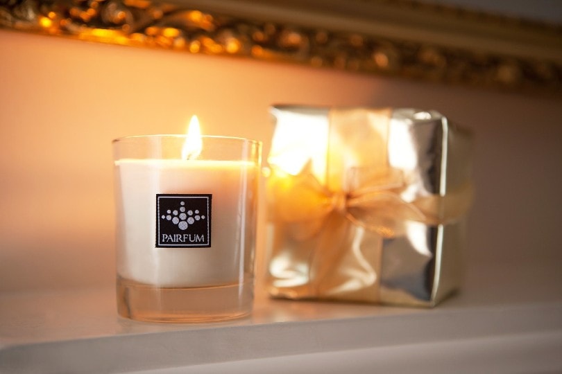 scented candle lit up at home