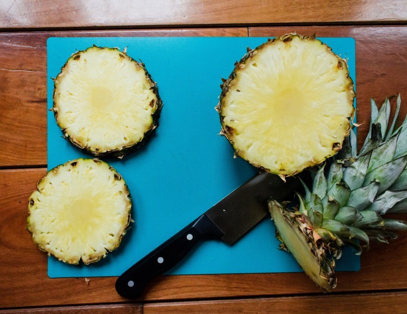 sliced pinapples on a wooden table