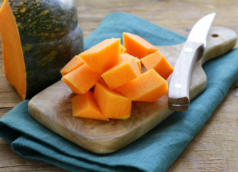 sliced pumpkin on kitchen board