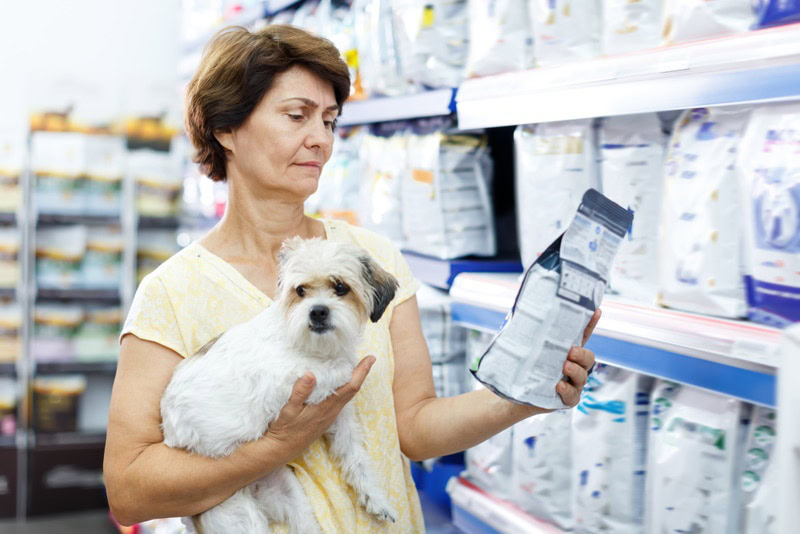woman buying dog food