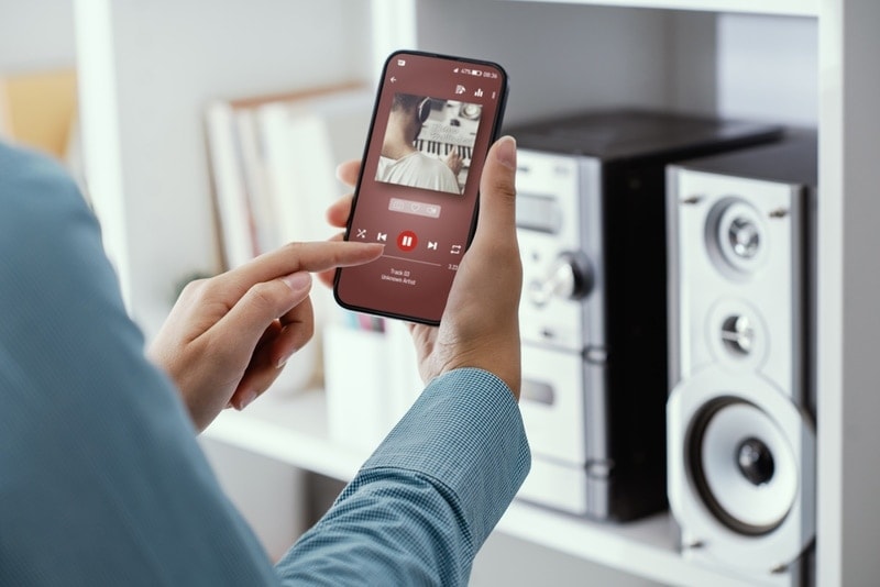 woman playing music in her phone
