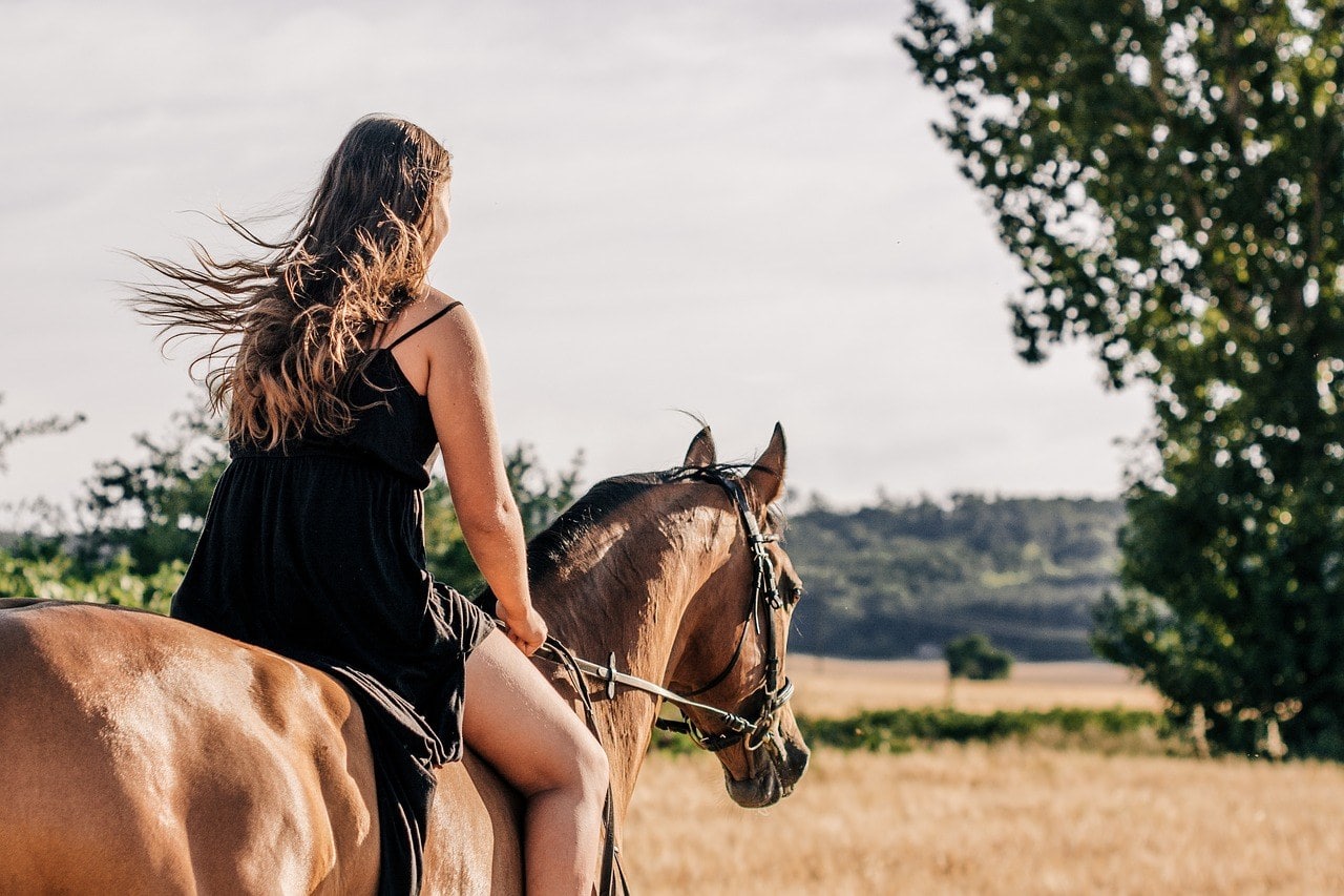 woman riding a horse